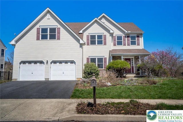 21 Millbrook Ct, Palmer Twp, PA 18045 - traditional-style home featuring an attached garage and driveway