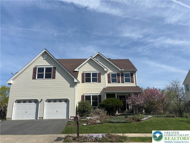 21 Millbrook Ct, Palmer Twp, PA 18045 - traditional-style house with an attached garage, driveway, and a front lawn