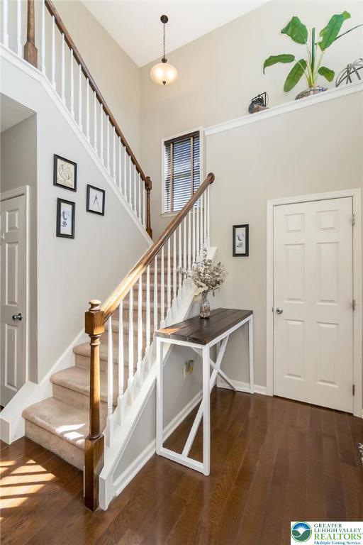 21 Millbrook Ct, Palmer Twp, PA 18045 - stairs with hardwood / wood-style flooring and a high ceiling