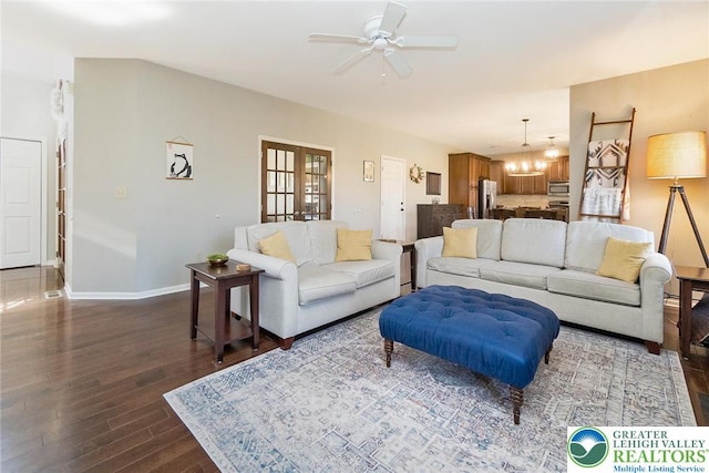 21 Millbrook Ct, Palmer Twp, PA 18045 - living area featuring dark wood-type flooring, ceiling fan, a chandelier, and french doors