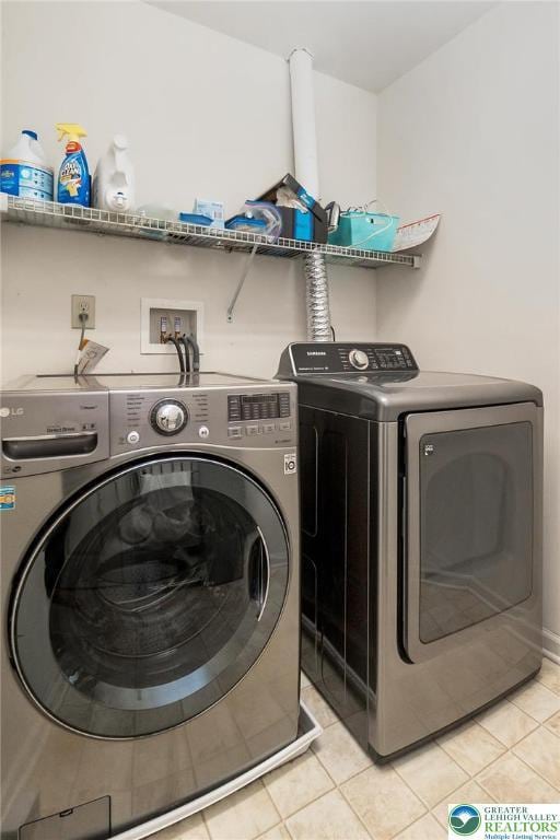 21 Millbrook Ct, Palmer Twp, PA 18045 - laundry room with washer and clothes dryer and light tile patterned flooring