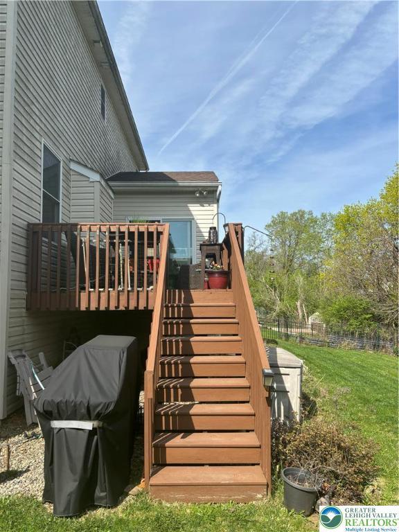 21 Millbrook Ct, Palmer Twp, PA 18045 - wooden deck with stairs, a yard, and a grill