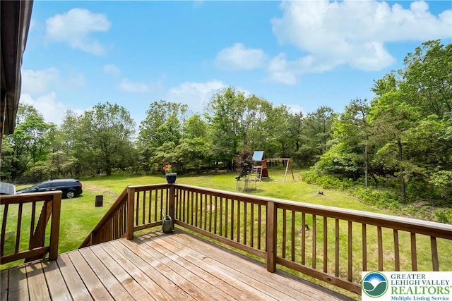 2227 Cheyenne Dr, Tunkhannock Township, PA 18610 - wooden terrace with a lawn, a playground, and view of scattered trees