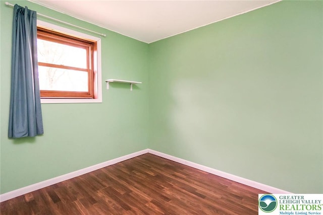 2227 Cheyenne Dr, Tunkhannock Township, PA 18610 - empty room with baseboards and dark wood-style floors