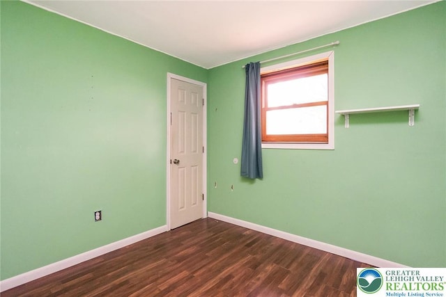 2227 Cheyenne Dr, Tunkhannock Township, PA 18610 - spare room with dark wood-style floors and baseboards