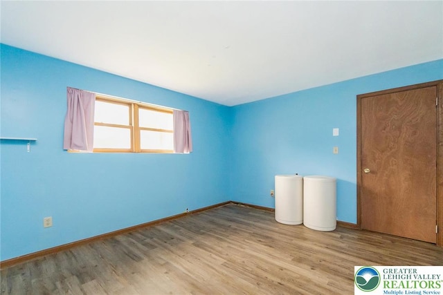 2227 Cheyenne Dr, Tunkhannock Township, PA 18610 - unfurnished bedroom featuring wood finished floors and baseboards