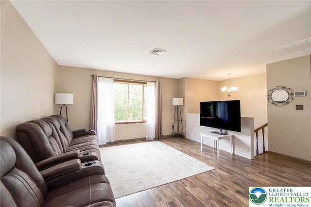2227 Cheyenne Dr, Tunkhannock Township, PA 18610 - living room featuring a chandelier and wood finished floors