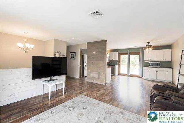 2227 Cheyenne Dr, Tunkhannock Township, PA 18610 - living area with dark wood finished floors, a ceiling fan, and a chandelier