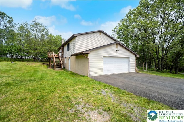 2227 Cheyenne Dr, Tunkhannock Township, PA 18610 - view of side of home with stairway, a chimney, a deck, a lawn, and a garage