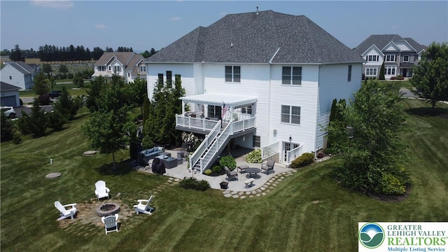 4323 Saratoga Dr, Lower Nazareth Twp, PA 18020 - back of house with an outdoor living space with a fire pit, a patio, stairway, and a yard