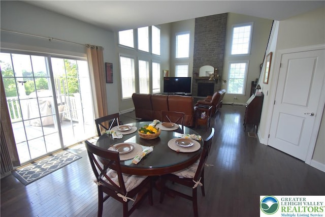 4323 Saratoga Dr, Lower Nazareth Twp, PA 18020 - dining area featuring dark wood-type flooring and a fireplace