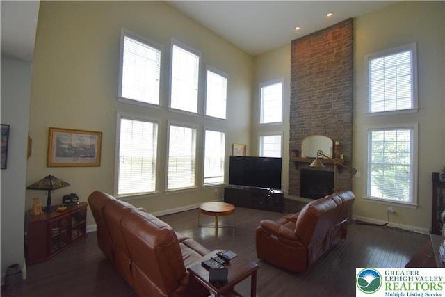 4323 Saratoga Dr, Lower Nazareth Twp, PA 18020 - living area featuring a high ceiling, wood finished floors, plenty of natural light, a brick fireplace, and recessed lighting