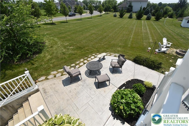 4323 Saratoga Dr, Lower Nazareth Twp, PA 18020 - view of green lawn featuring a patio and a fire pit