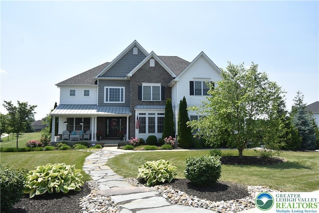4323 Saratoga Dr, Lower Nazareth Twp, PA 18020 - view of front facade with covered porch, a front lawn, and a standing seam roof