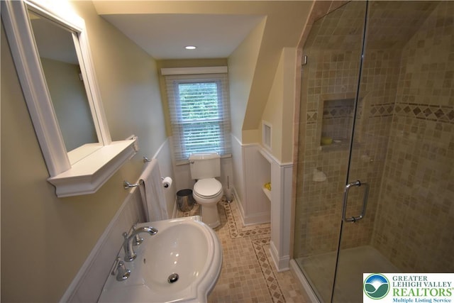 407 W Burke St, Easton, PA 18042 - bathroom featuring a shower stall, wainscoting, and tile patterned flooring