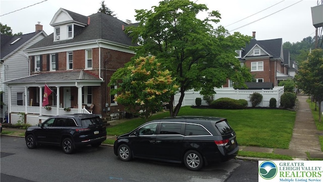 407 W Burke St, Easton, PA 18042 - view of front of property with brick siding and a porch