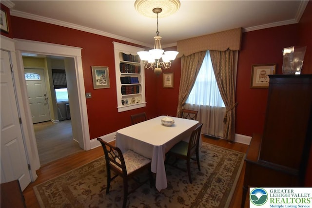407 W Burke St, Easton, PA 18042 - dining area with a chandelier, wood finished floors, and crown molding