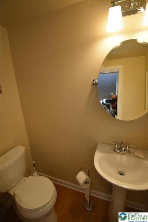 407 W Burke St, Easton, PA 18042 - half bath with toilet and wood finished floors