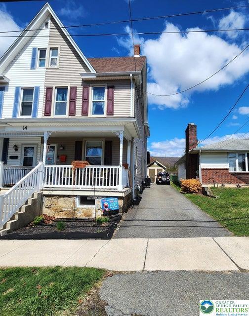 14 W 10th St, Jim Thorpe Borough, PA 18229 - view of front of house featuring covered porch, a chimney, and driveway