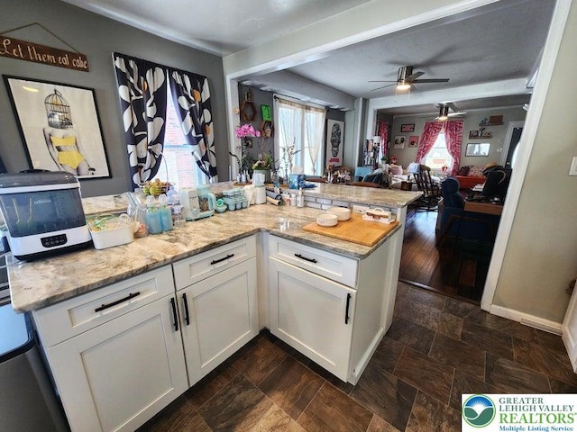 14 W 10th St, Jim Thorpe Borough, PA 18229 - kitchen featuring open floor plan, white cabinetry, a ceiling fan, and light stone countertops
