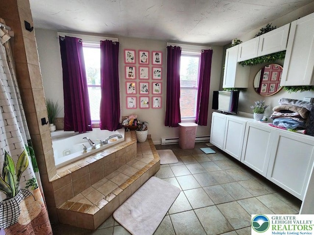 14 W 10th St, Jim Thorpe Borough, PA 18229 - full bathroom with healthy amount of natural light, a bath, a baseboard radiator, and tile patterned floors