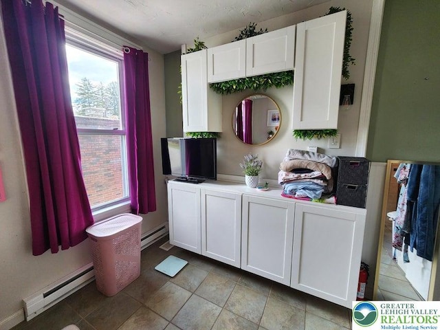 14 W 10th St, Jim Thorpe Borough, PA 18229 - kitchen featuring a baseboard radiator, white cabinetry, and plenty of natural light