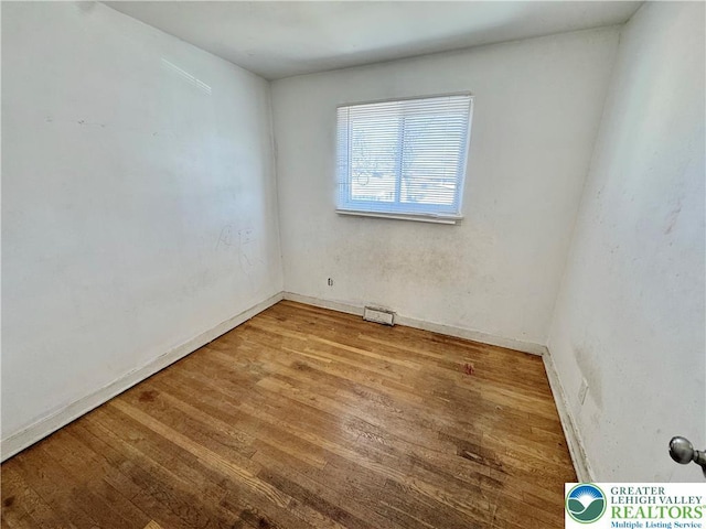 909 Genesee St, Allentown City, PA 18103 - spare room with wood finished floors and baseboards