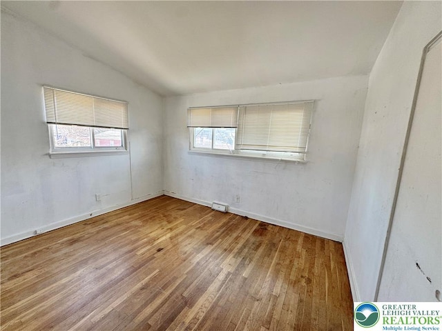 909 Genesee St, Allentown City, PA 18103 - spare room featuring hardwood / wood-style flooring and vaulted ceiling