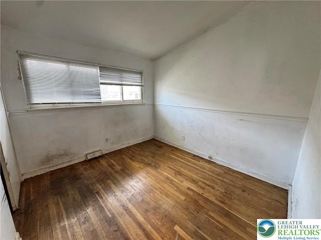 909 Genesee St, Allentown City, PA 18103 - spare room featuring wood-type flooring and baseboards