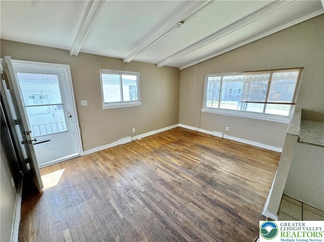 909 Genesee St, Allentown City, PA 18103 - unfurnished living room with wood finished floors and baseboards
