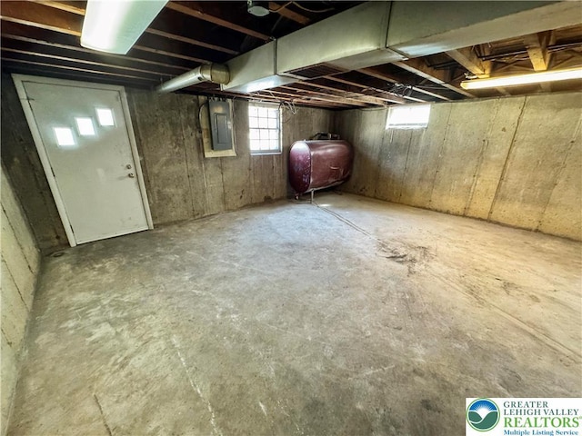 909 Genesee St, Allentown City, PA 18103 - below grade area featuring oil tank, electric panel, and healthy amount of natural light