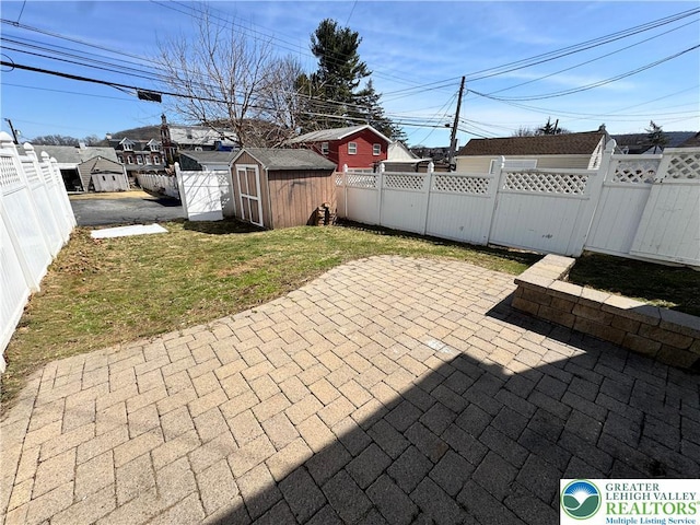 909 Genesee St, Allentown City, PA 18103 - fenced backyard with a patio area and a storage shed