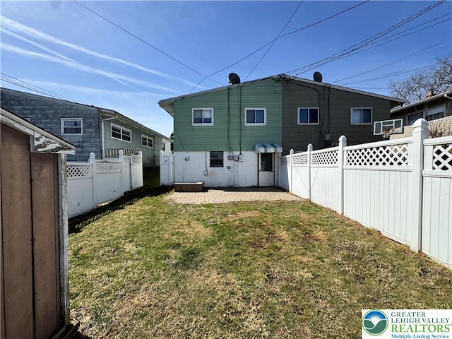 909 Genesee St, Allentown City, PA 18103 - rear view of property with a fenced backyard and a patio area