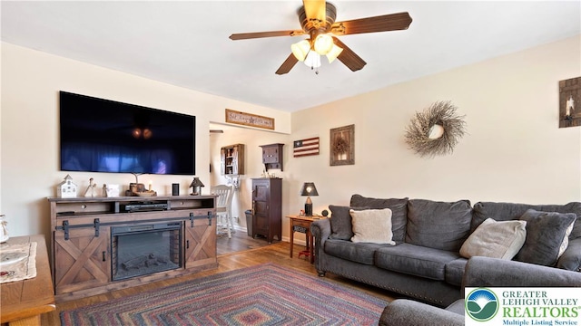 3063 Clearview St, Palmer Twp, PA 18045 - living room with a ceiling fan and a glass covered fireplace