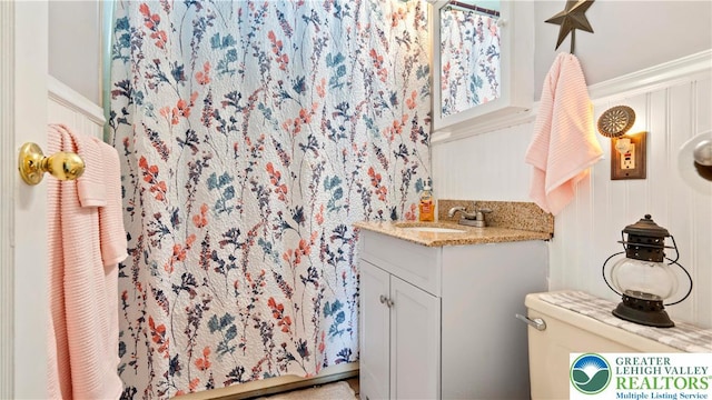 3063 Clearview St, Palmer Twp, PA 18045 - bathroom featuring vanity, a shower with curtain, and a decorative wall