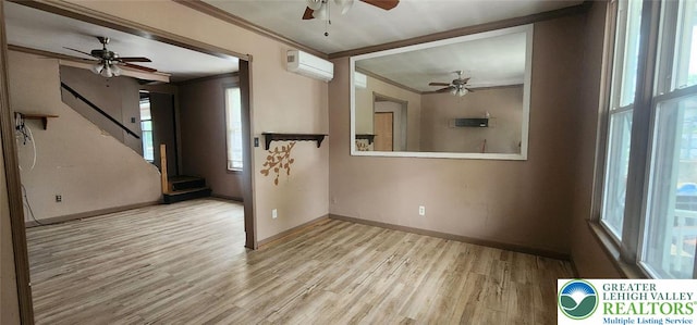 2463 Hillside Ave, Wilson Boro, PA 18042 - empty room with ceiling fan, a wall mounted air conditioner, crown molding, wood finished floors, and stairway