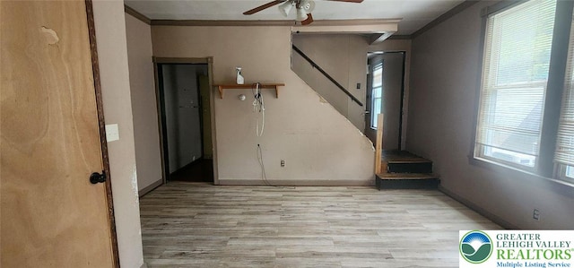 2463 Hillside Ave, Wilson Boro, PA 18042 - empty room with a ceiling fan, wood finished floors, crown molding, and stairway