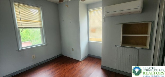 2463 Hillside Ave, Wilson Boro, PA 18042 - spare room with a wall mounted air conditioner, healthy amount of natural light, wood finished floors, and a ceiling fan