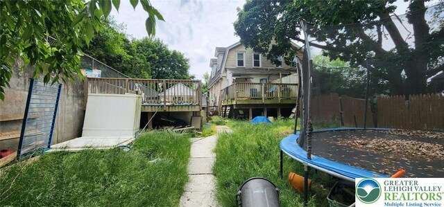 2463 Hillside Ave, Wilson Boro, PA 18042 - view of yard with a trampoline and a wooden deck