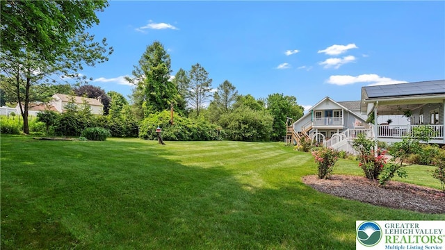 807 Bangor Rd, Plainfield Twp, PA 18064 - view of green lawn featuring a porch and stairway