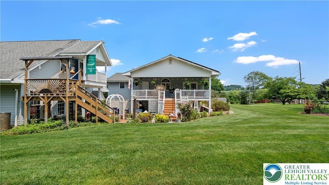 807 Bangor Rd, Plainfield Twp, PA 18064 - view of front of property featuring stairway, a front yard, a shingled roof, and covered porch