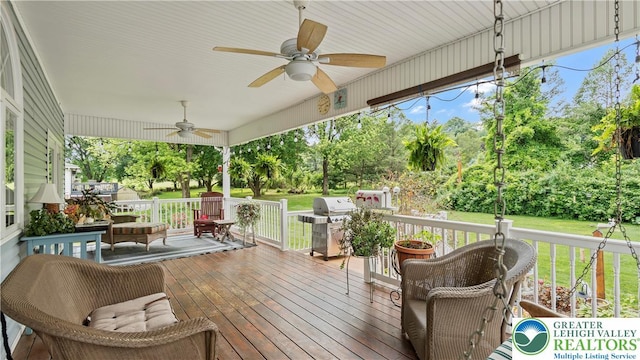 807 Bangor Rd, Plainfield Twp, PA 18064 - wooden terrace featuring a ceiling fan, area for grilling, view of scattered trees, and a lawn