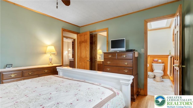 807 Bangor Rd, Plainfield Twp, PA 18064 - bedroom with crown molding, ensuite bathroom, a closet, wood finished floors, and a ceiling fan