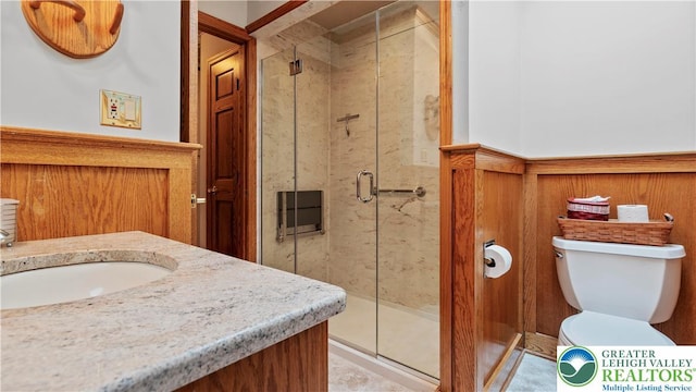 807 Bangor Rd, Plainfield Twp, PA 18064 - bathroom with vanity, a stall shower, and a wainscoted wall