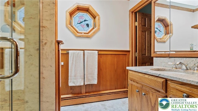 807 Bangor Rd, Plainfield Twp, PA 18064 - bathroom with a wainscoted wall, vanity, a shower with shower door, and tile patterned floors