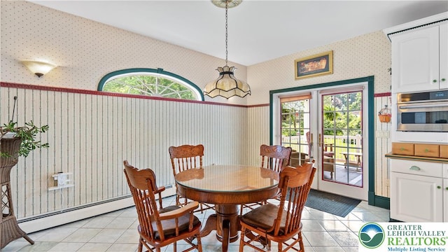 807 Bangor Rd, Plainfield Twp, PA 18064 - dining space with wallpapered walls, light tile patterned flooring, plenty of natural light, and a baseboard radiator