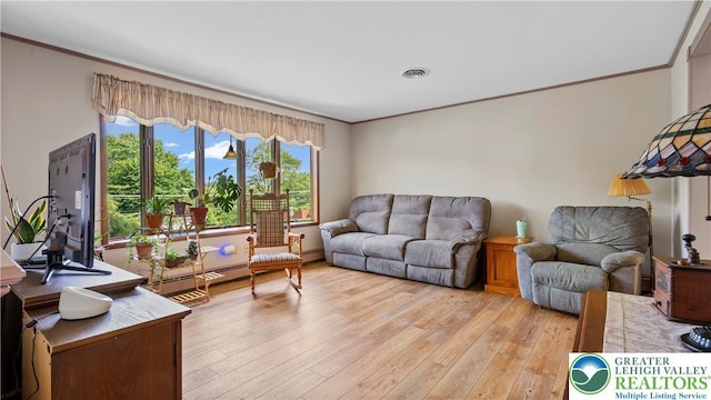 807 Bangor Rd, Plainfield Twp, PA 18064 - living area with ornamental molding, light wood-style floors, and baseboard heating