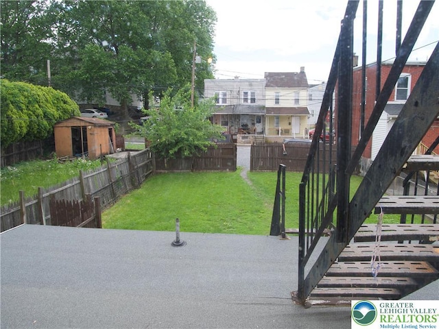 266 E Walnut St, Allentown City, PA 18109 - view of property's community featuring a fenced backyard, a patio area, and a storage unit