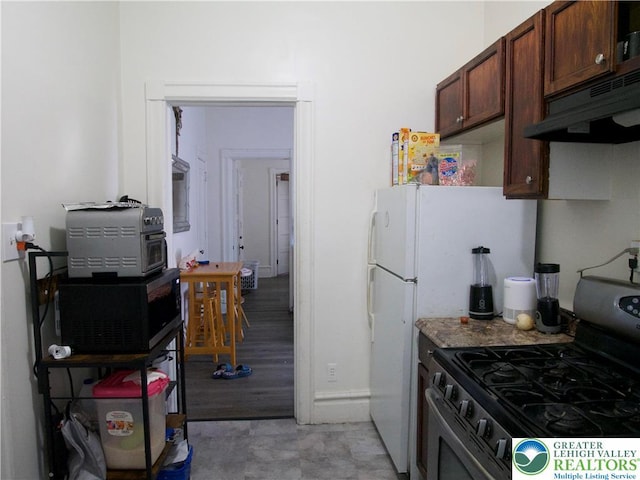 266 E Walnut St, Allentown City, PA 18109 - kitchen featuring stainless steel gas range, under cabinet range hood, and black microwave