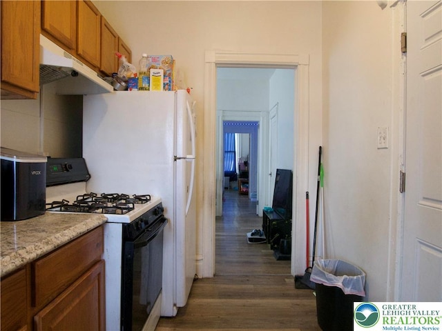 266 E Walnut St, Allentown City, PA 18109 - kitchen with range with gas cooktop, under cabinet range hood, dark wood-style floors, brown cabinets, and light countertops